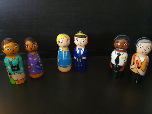 Set of colorful figurines representing different professions on a black background